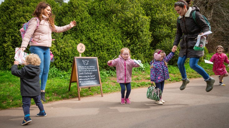 Families doing activities on Easter trail at Tyntesfield, Somerset